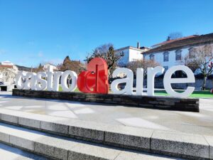Large outdoor sign reading 'castro' and 'aire' with a red heart between the words