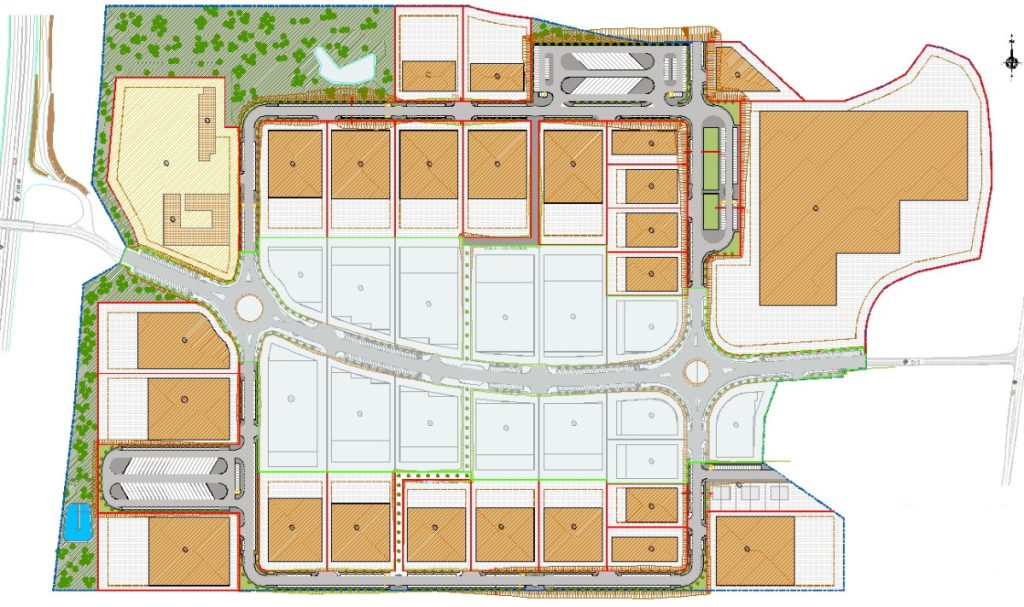 Detailed site plan of a development with roads, roundabout, building plots, parking, and green spaces.
